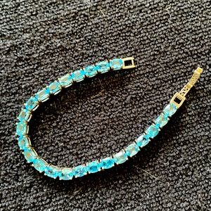 Worn once - excellent condition. Bright blue stones
